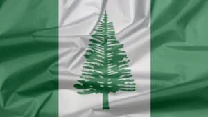 Norfolk Island flag behind building supplies text